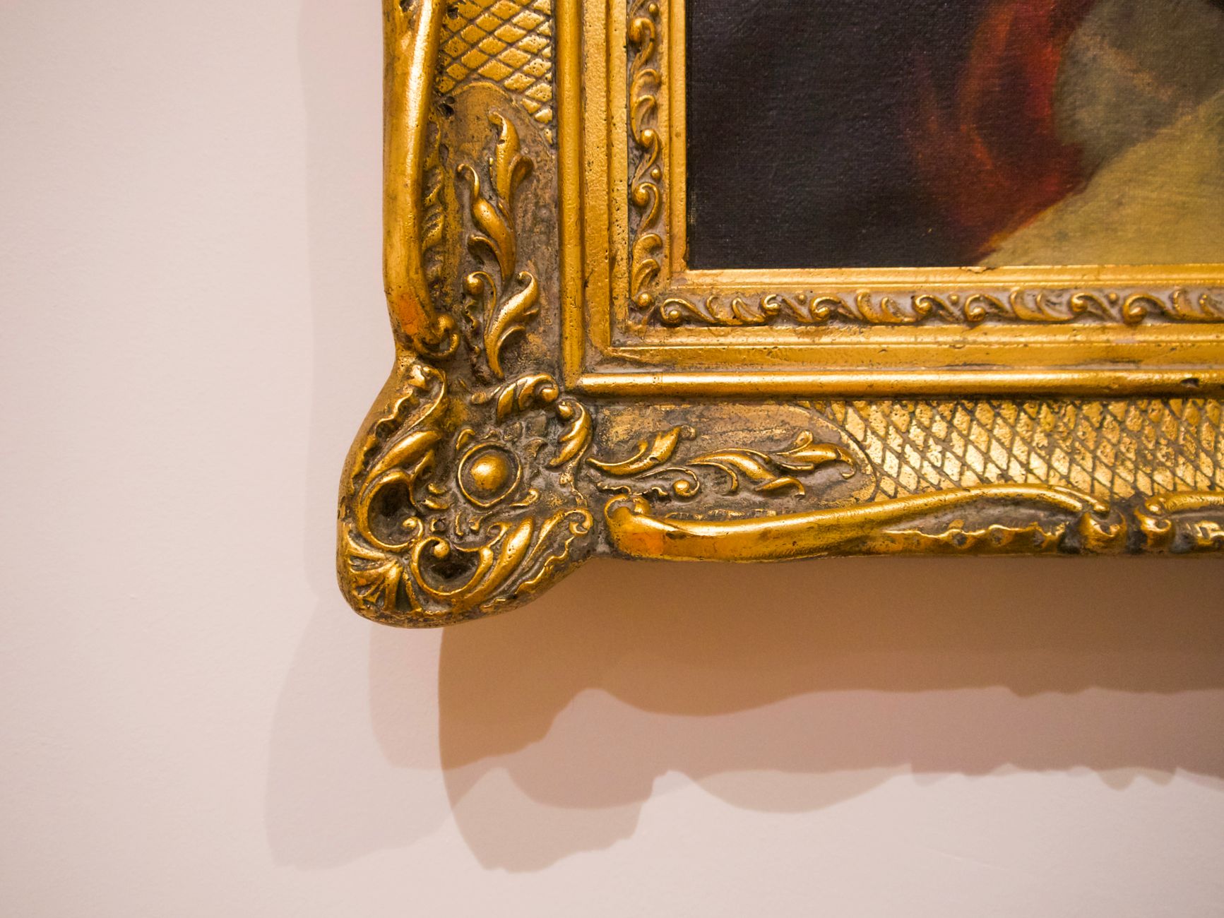 Close-up of an ornate gold picture frame