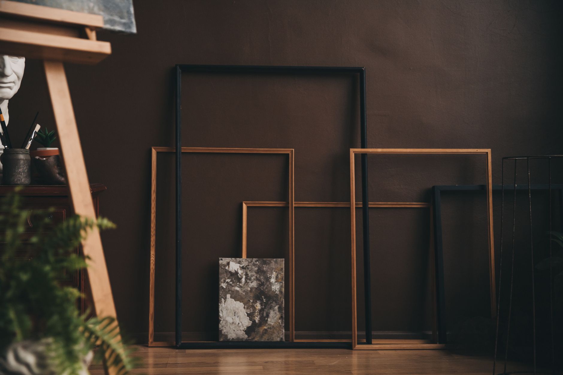 Wooden picture frames arranged in a framing studio
